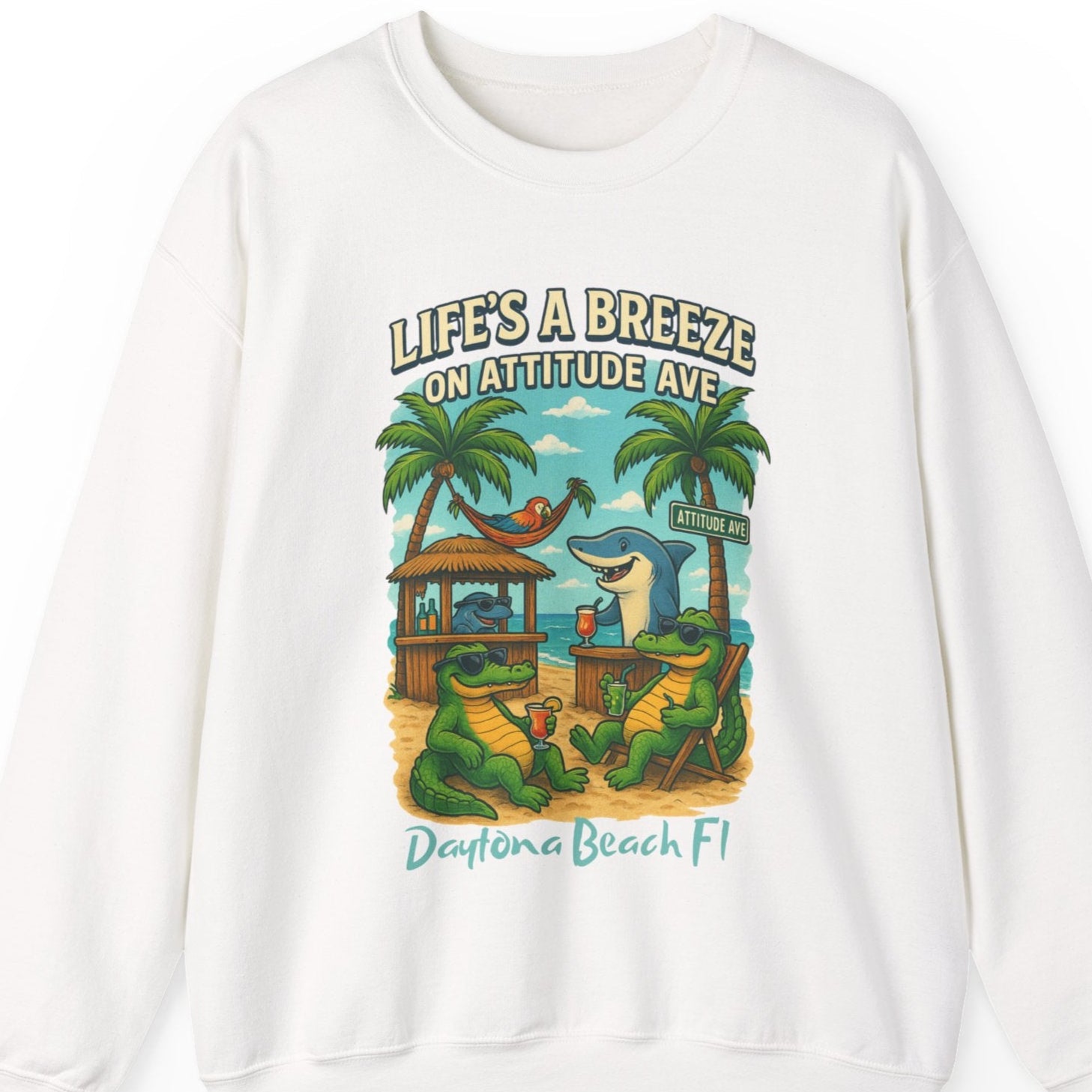 White sweatshirt with a beach-themed graphic and text on a white background