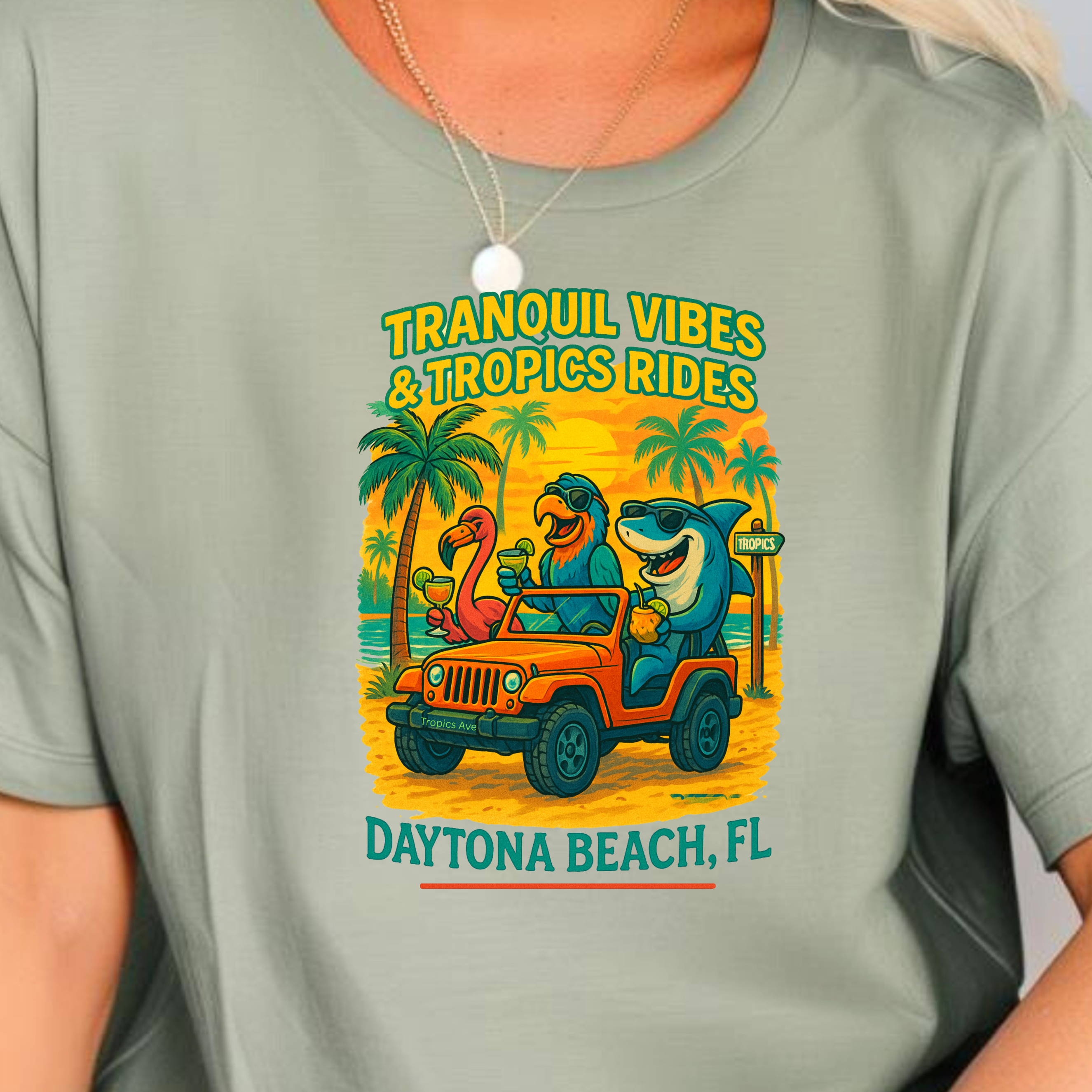 Woman wearing a t-shirt with a graphic design and text, sitting on a couch.