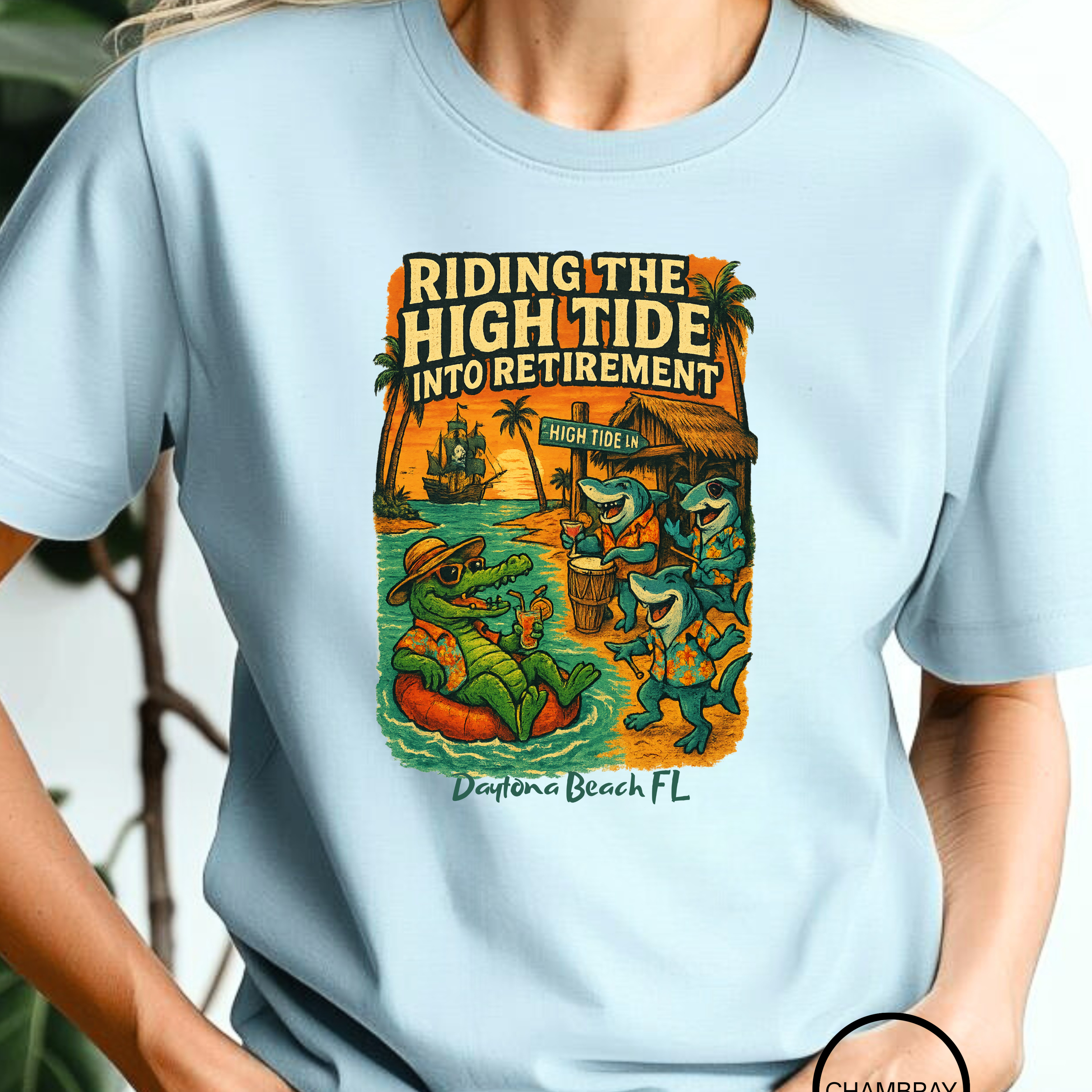 Person wearing a light blue t-shirt with a graphic design and text.