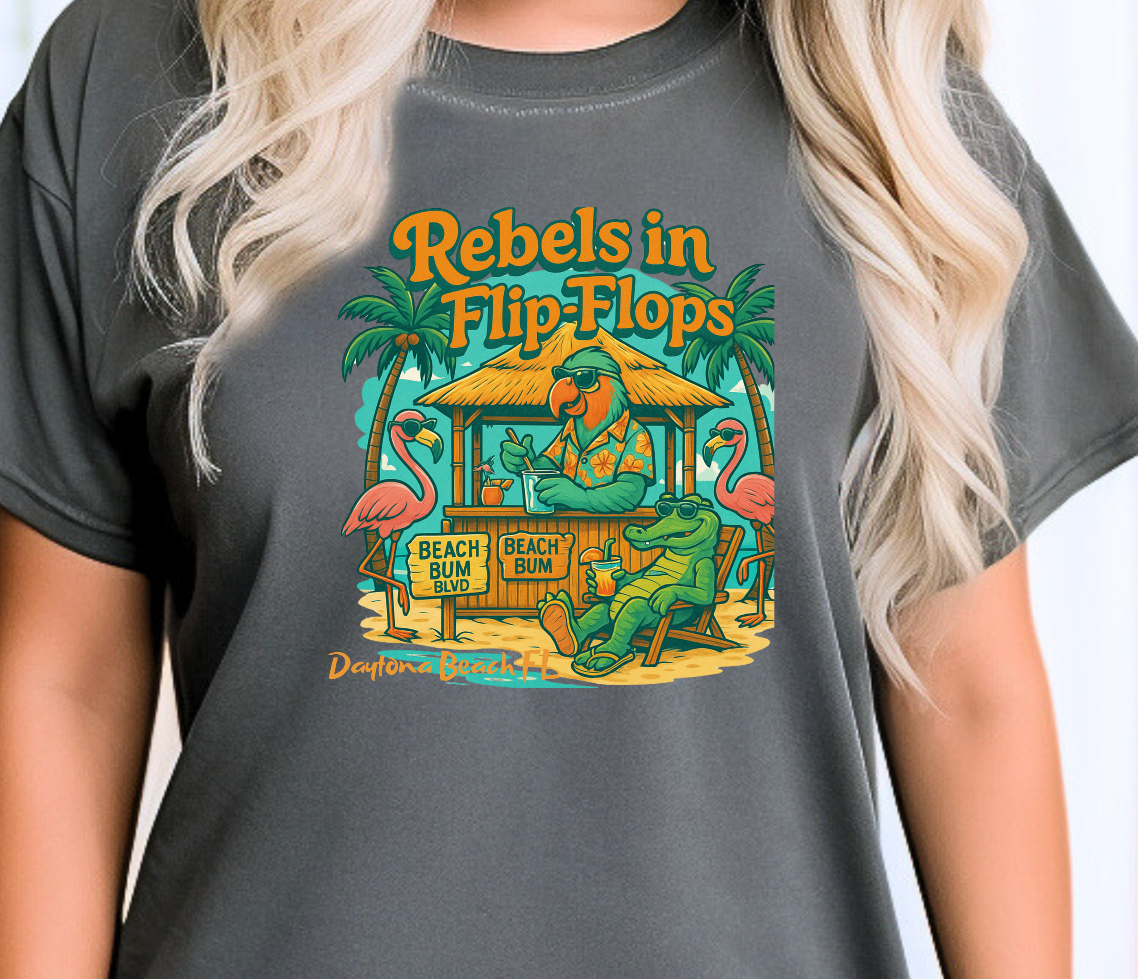 Person wearing a gray t-shirt with 'Rebels in Flip Flops' graphic design.