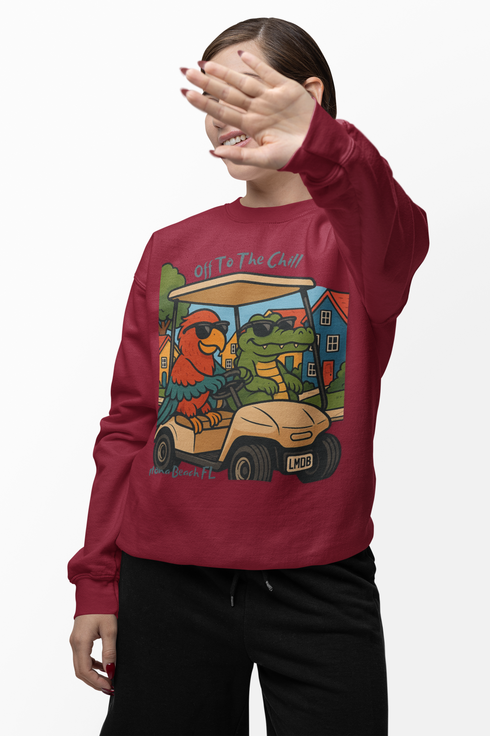 Person wearing a red sweatshirt with a colorful graphic design on a white background