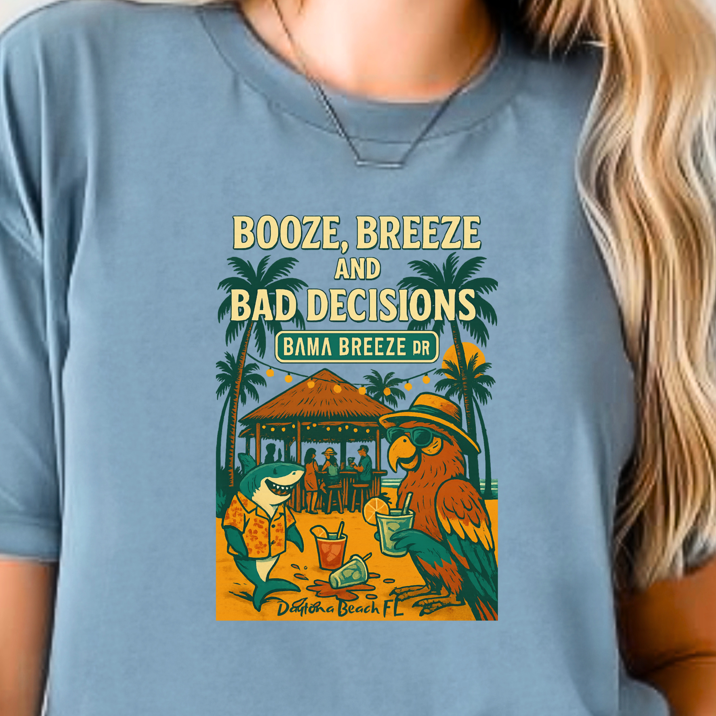 Person wearing a blue t-shirt with a graphic design and text.