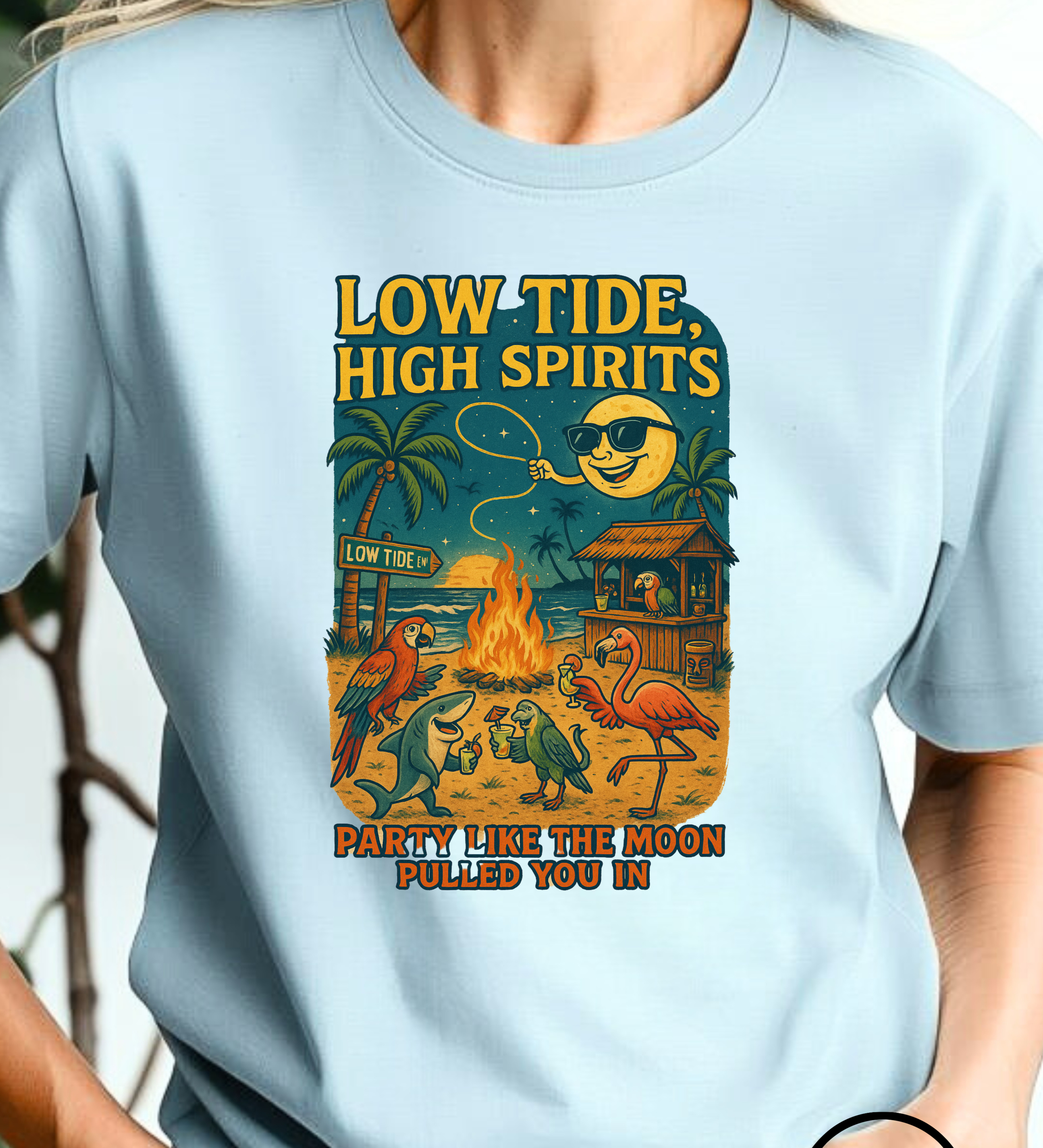 Light blue t-shirt with a colorful graphic design and text, worn by a person.