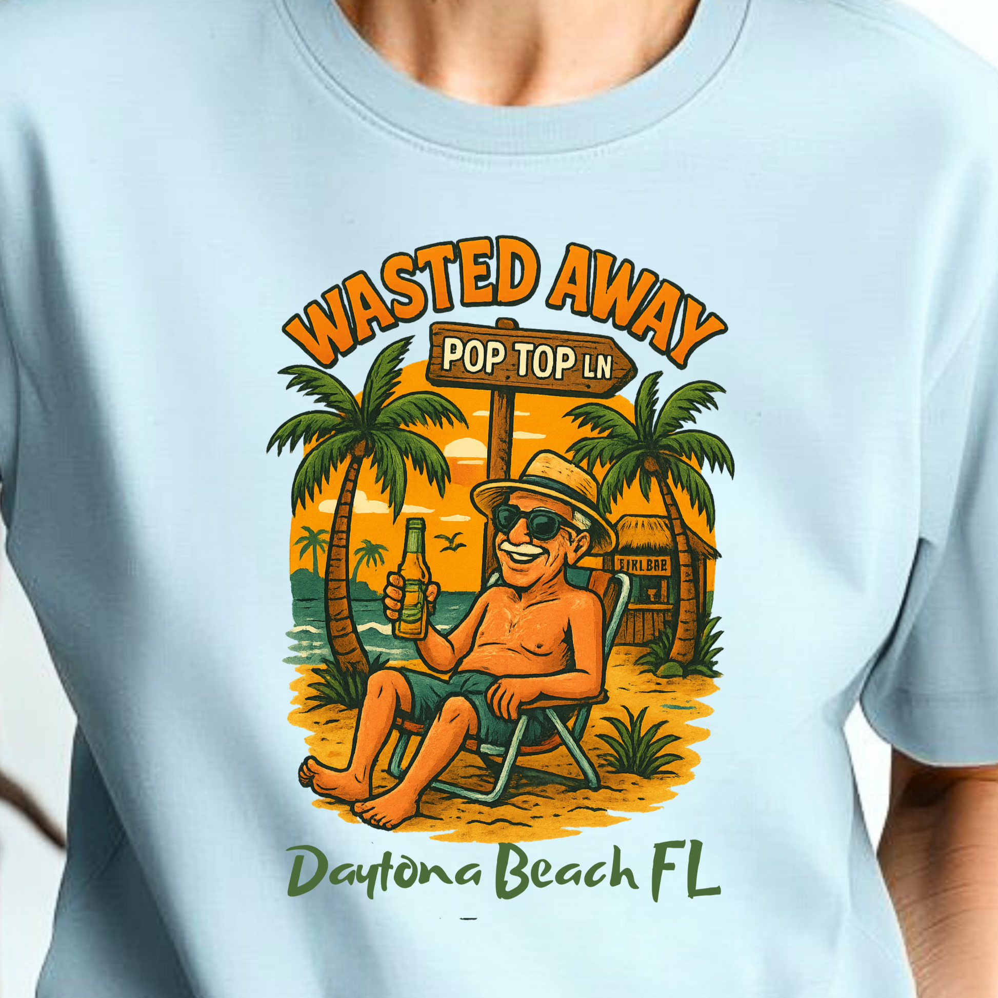 Person wearing a light blue t-shirt with a tropical graphic design.