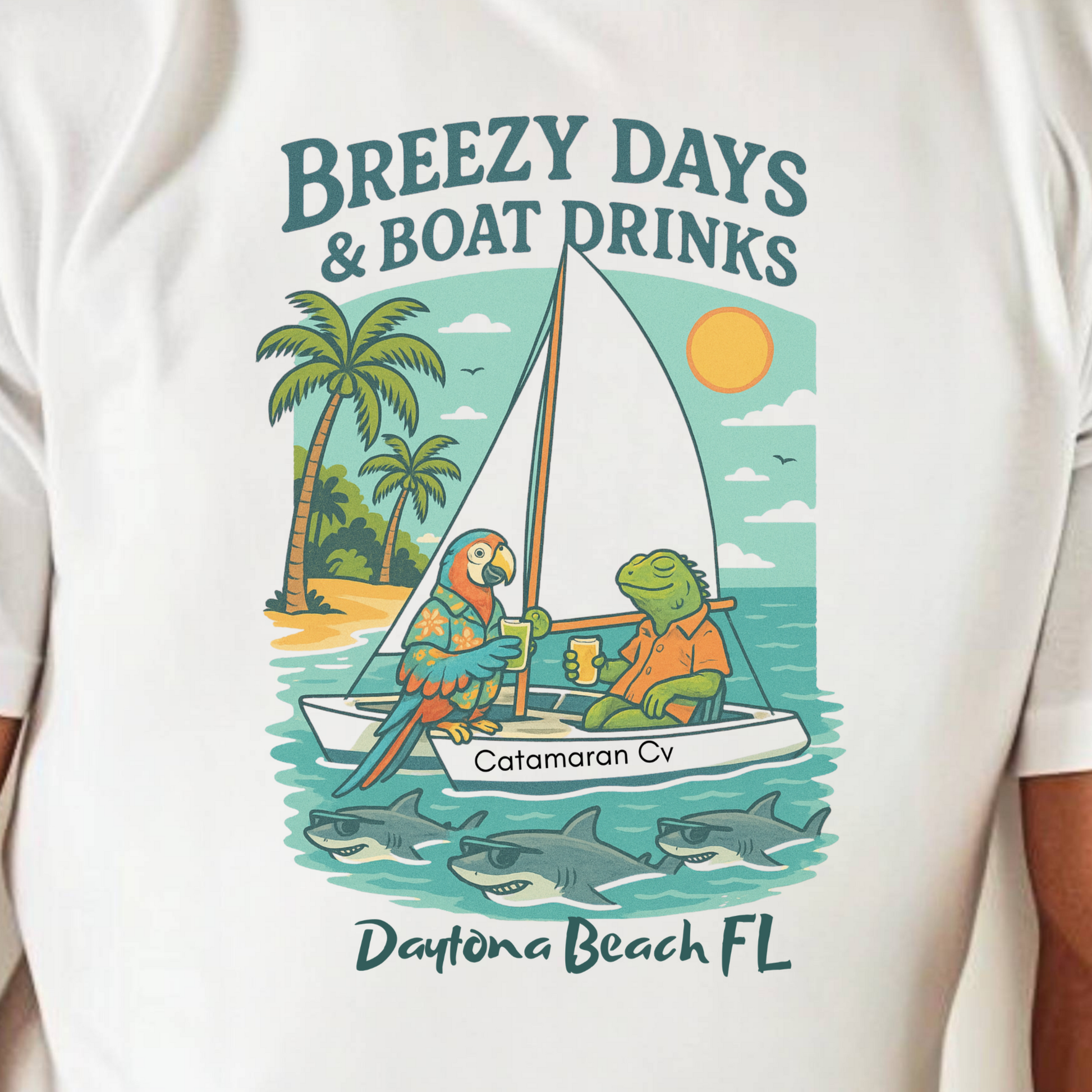 White t-shirt with a graphic design of a sailboat, parrot, and turtle with text 'Breezy Days & Boat Drinks' and 'Daytona Beach FL'.