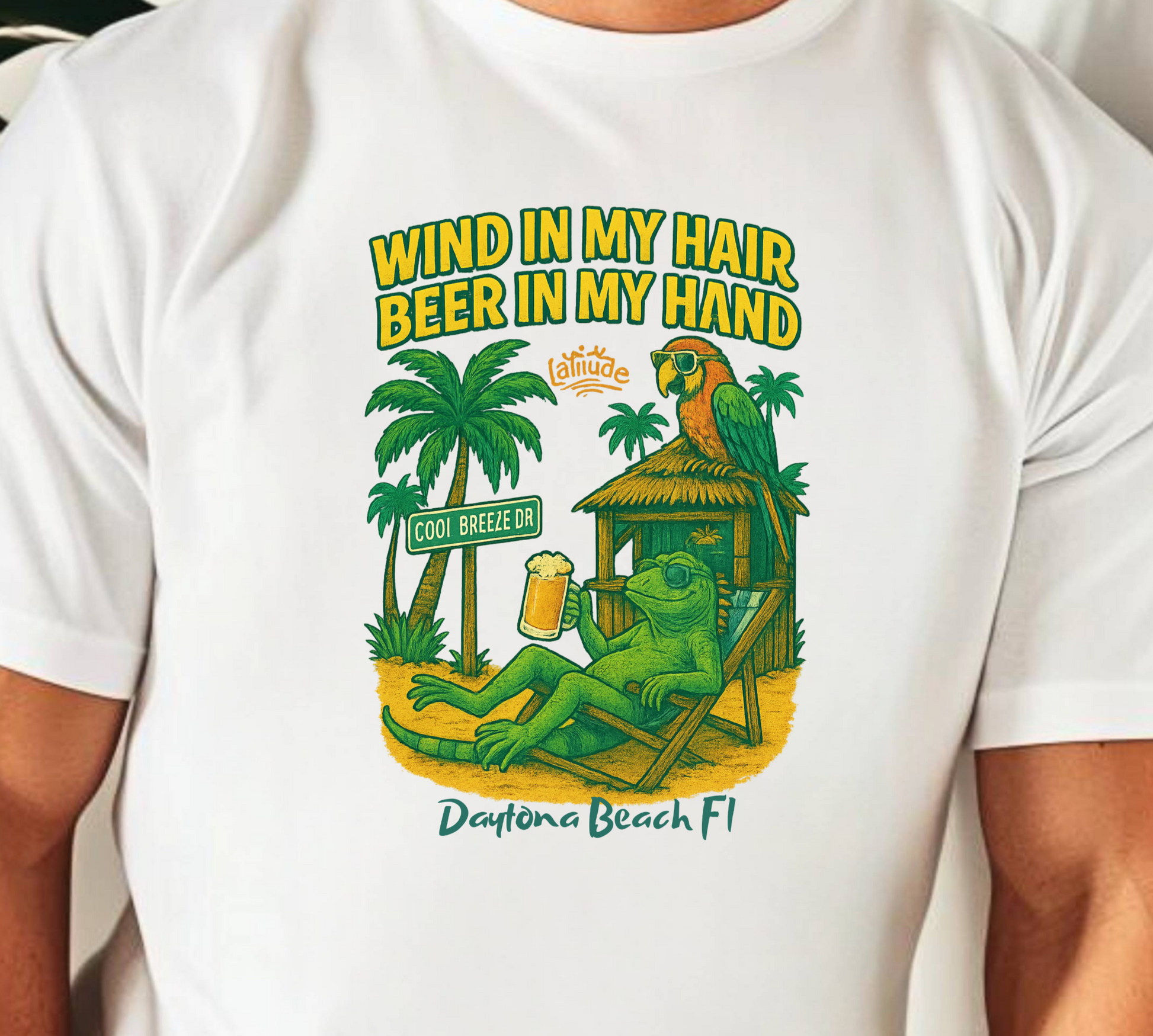 White t-shirt with a tropical graphic design featuring a frog, palm trees, and a hut.