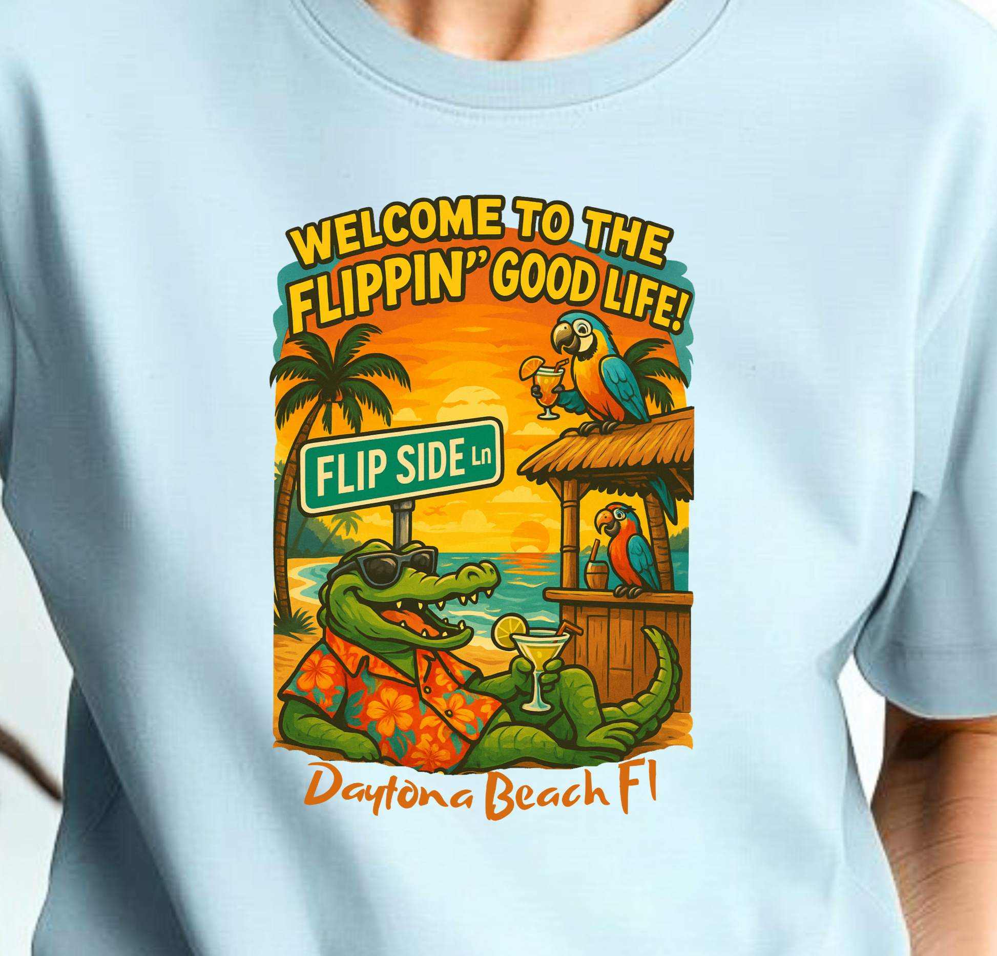 Person wearing a light blue t-shirt with a graphic design and text.