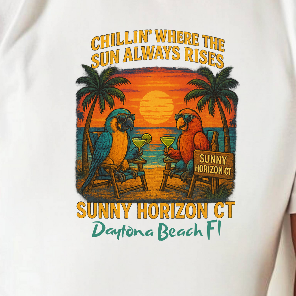 White t-shirt with a tropical graphic and text, worn by a person.