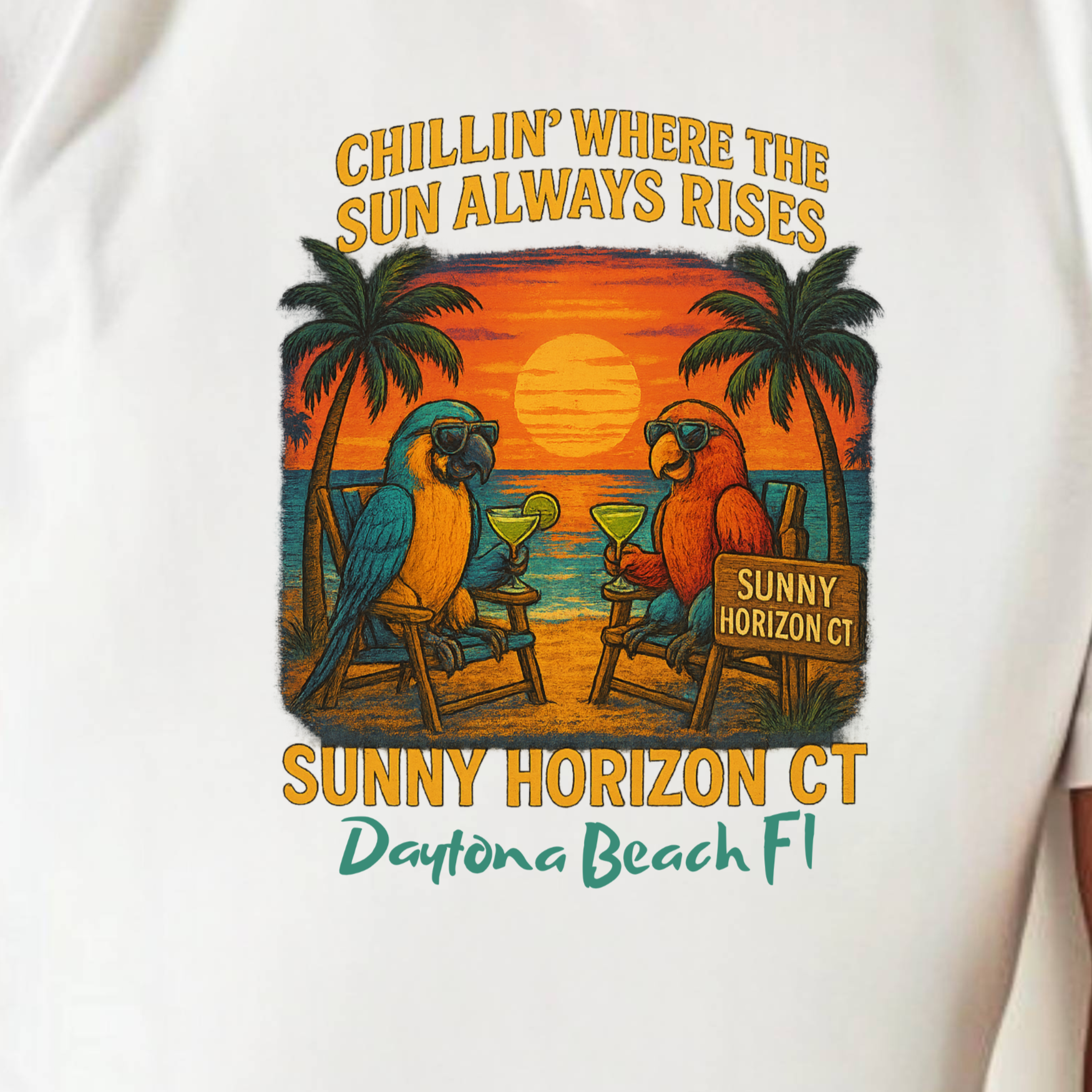 White t-shirt with a tropical graphic and text, worn by a person.