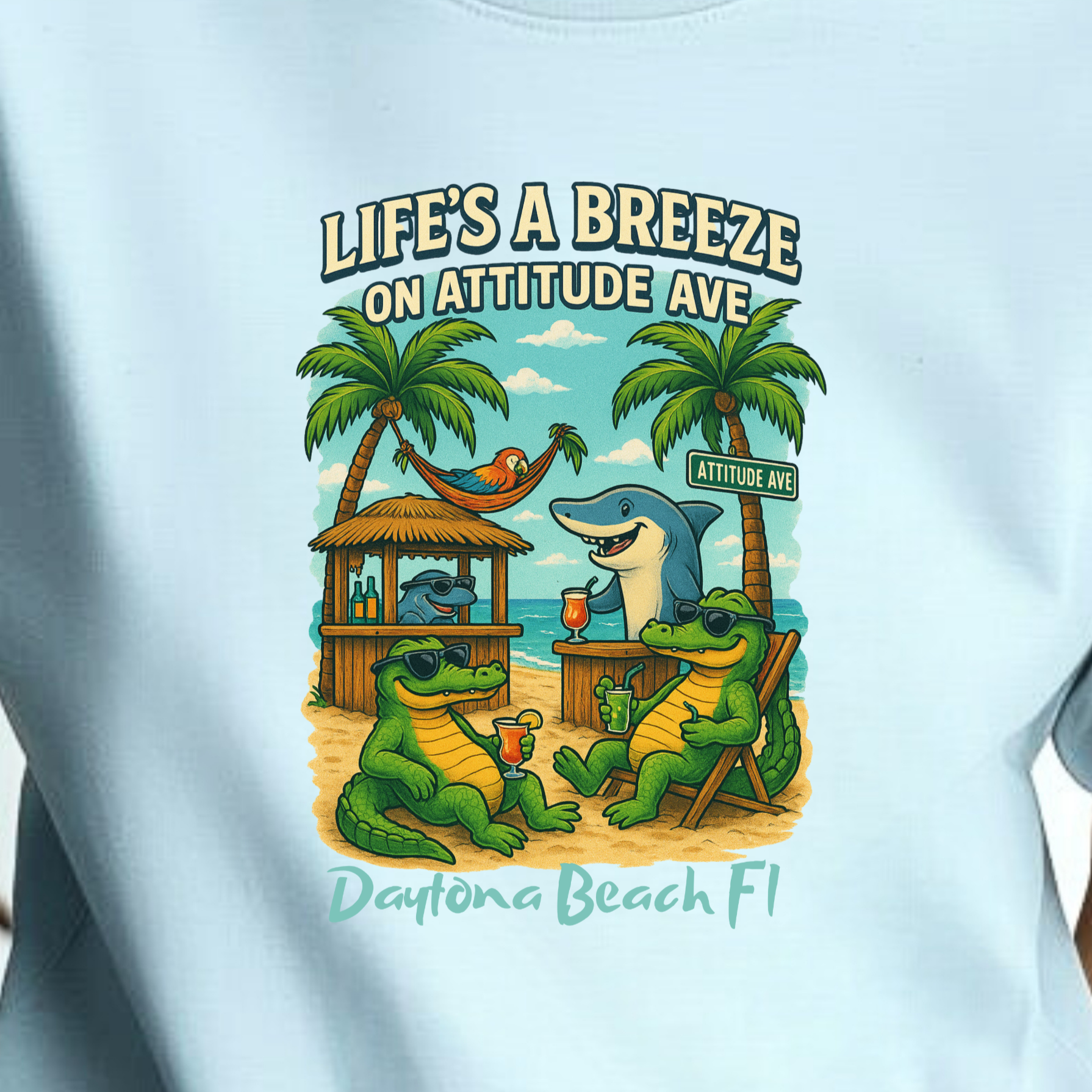 Person wearing a light blue t-shirt with a graphic design and text.